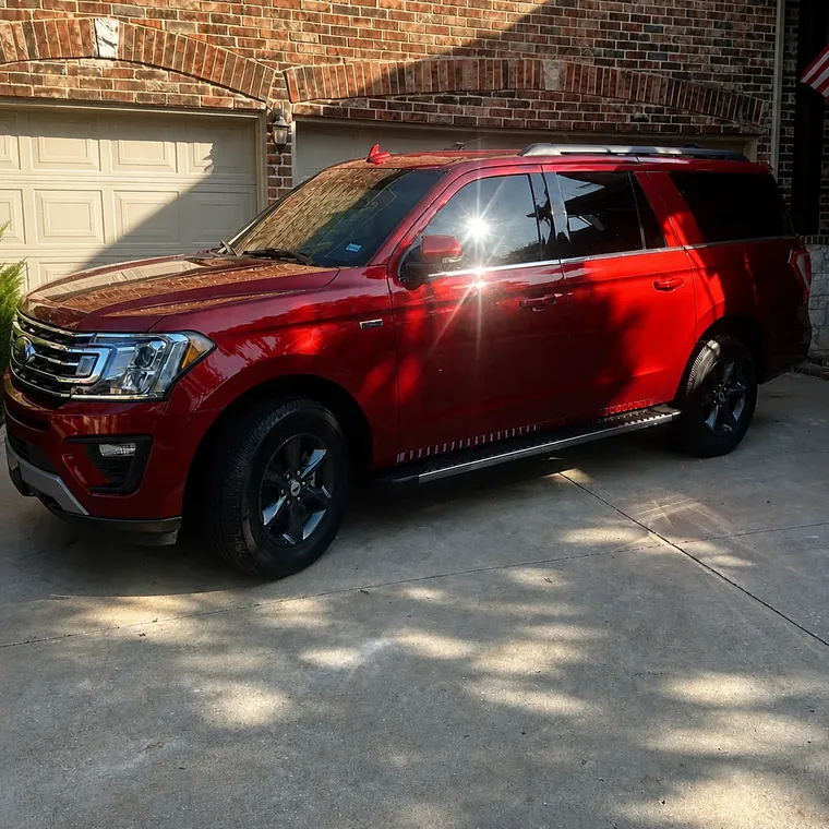 Ford Expedition washed and finished in a driveway